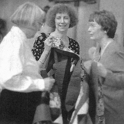 Eva Jackson (left) is the winner of the
rhododendron quilt made by Adele Jones (center) and Paula Cash (right).